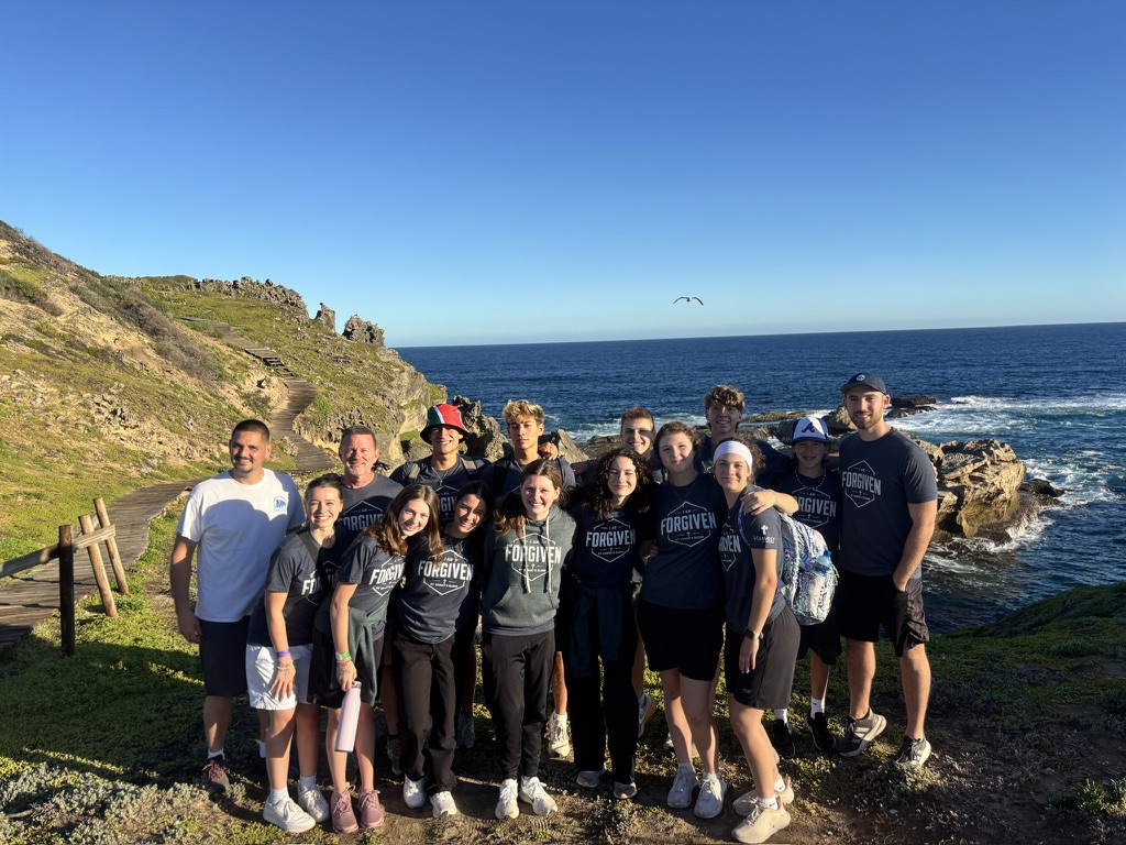 A visiting group together on the South African coast